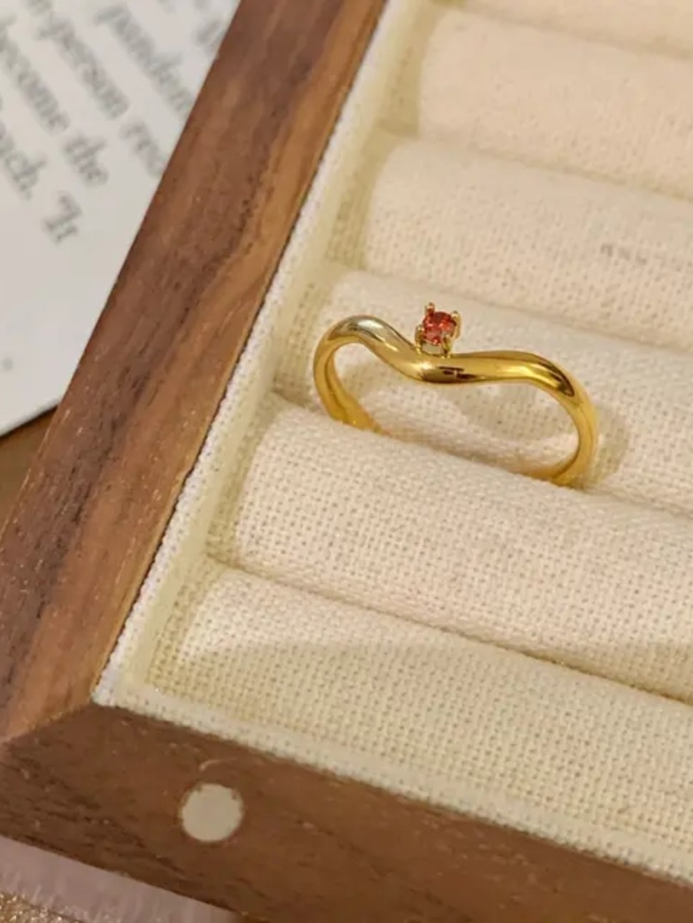 Gold Wave Ring with Red Gemstone